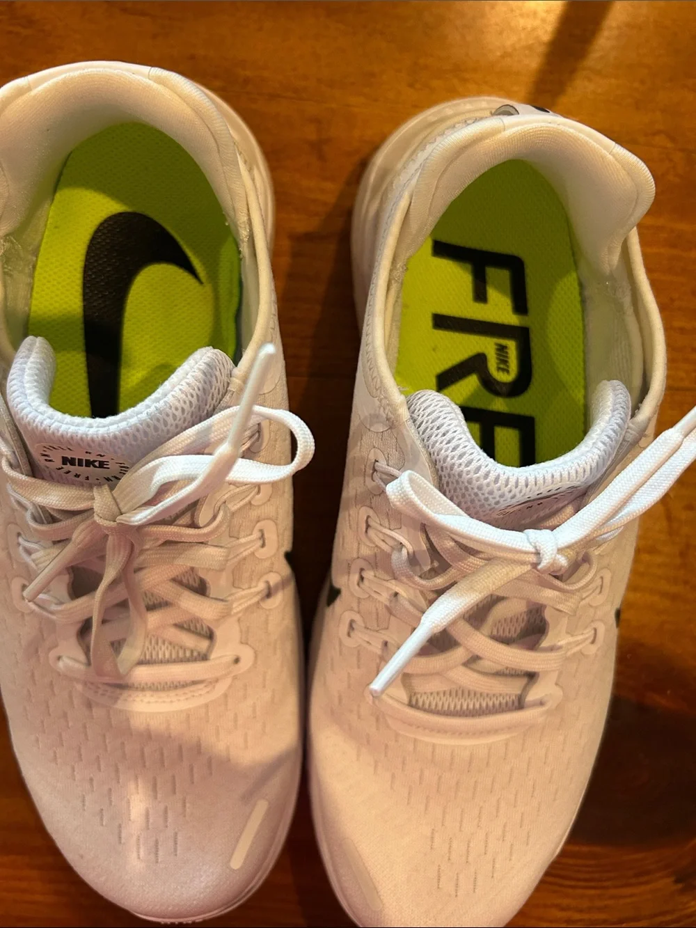 Nike Women’s White Athletic Running Shoes with Black Swoosh